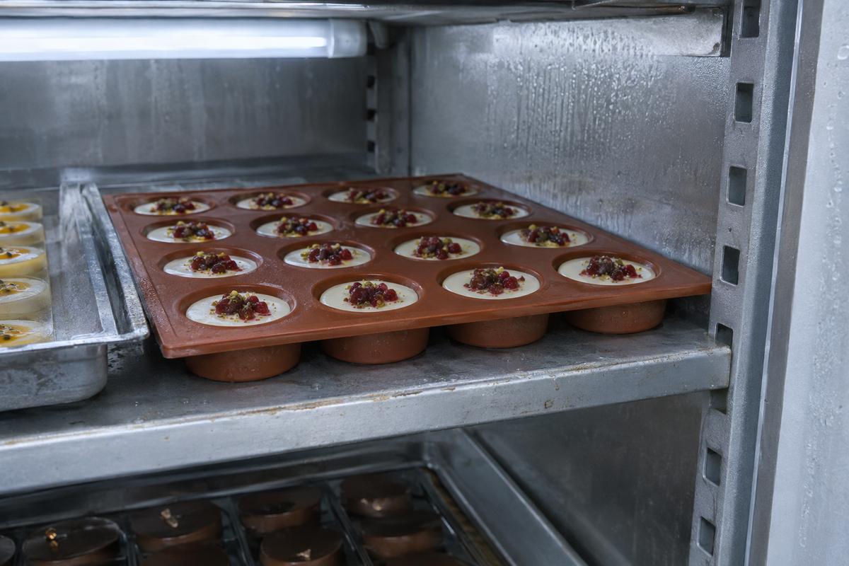 Custom silicone tray closely fitted to a chiller shelf