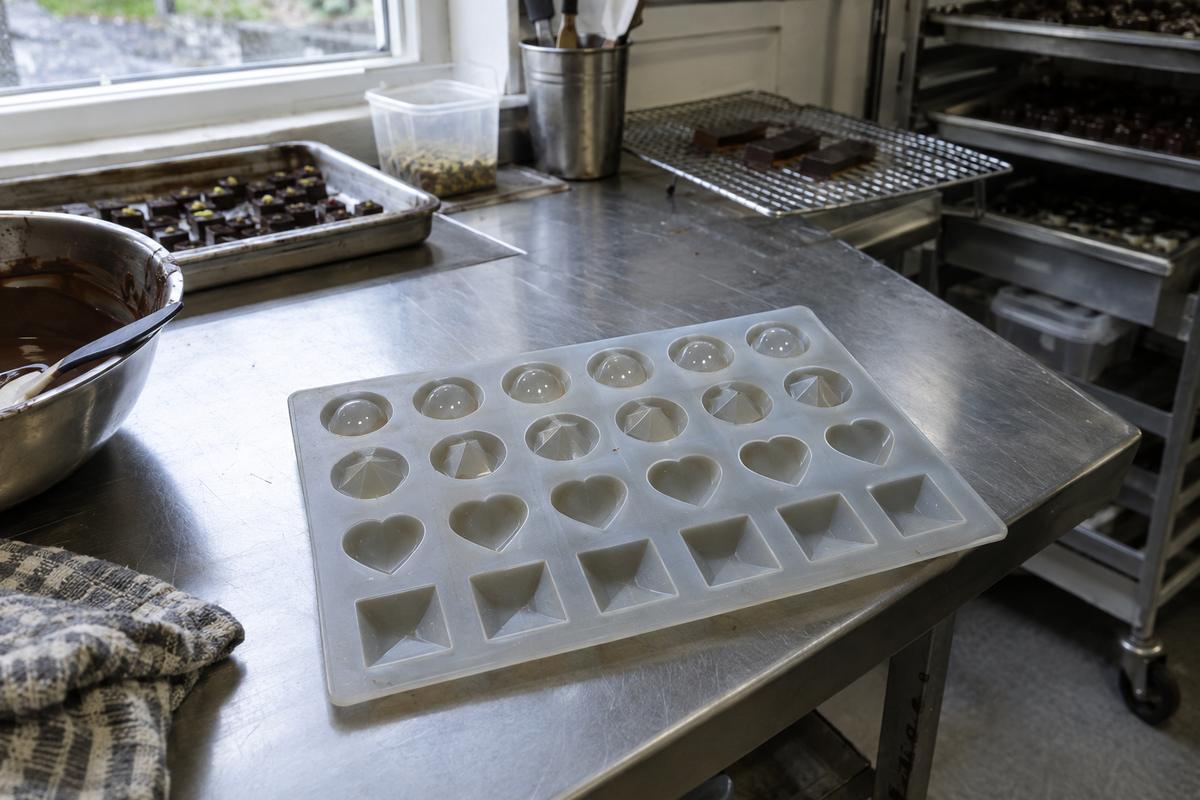 Custom tasting tray mould with repeated cavity shapes on a bench