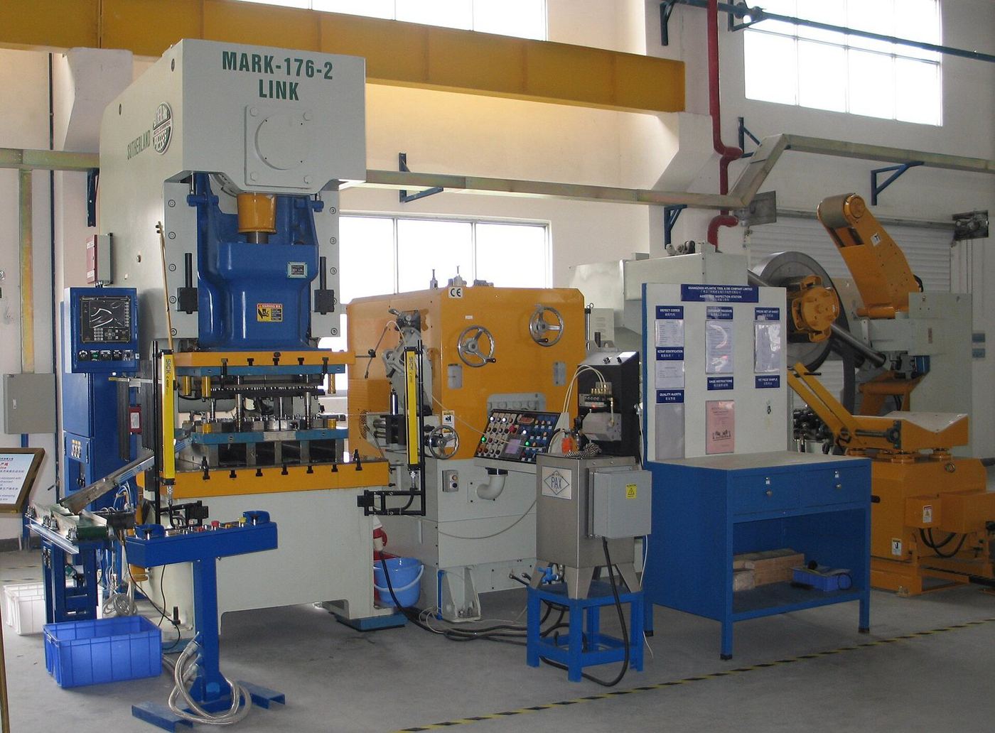 Gap-frame stamping press with coil feeder.