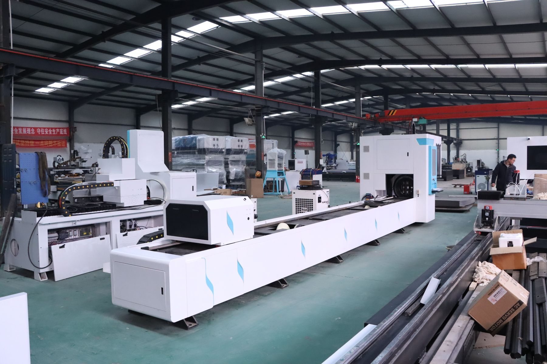 Automated fibre-laser cutting lines in a modern factory.
