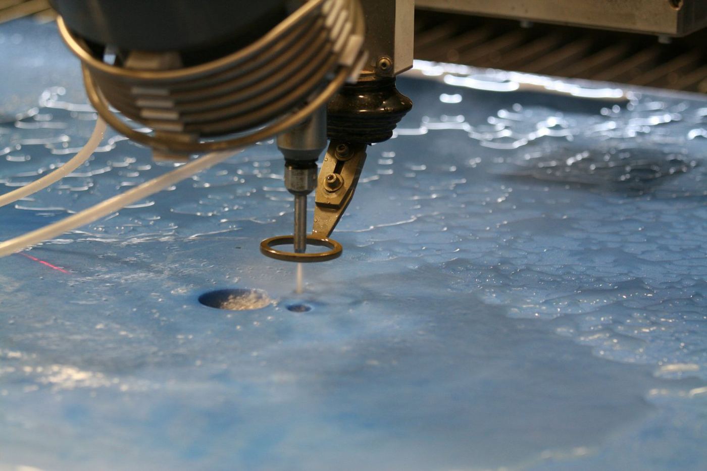 Abrasive waterjet cutting in progress.